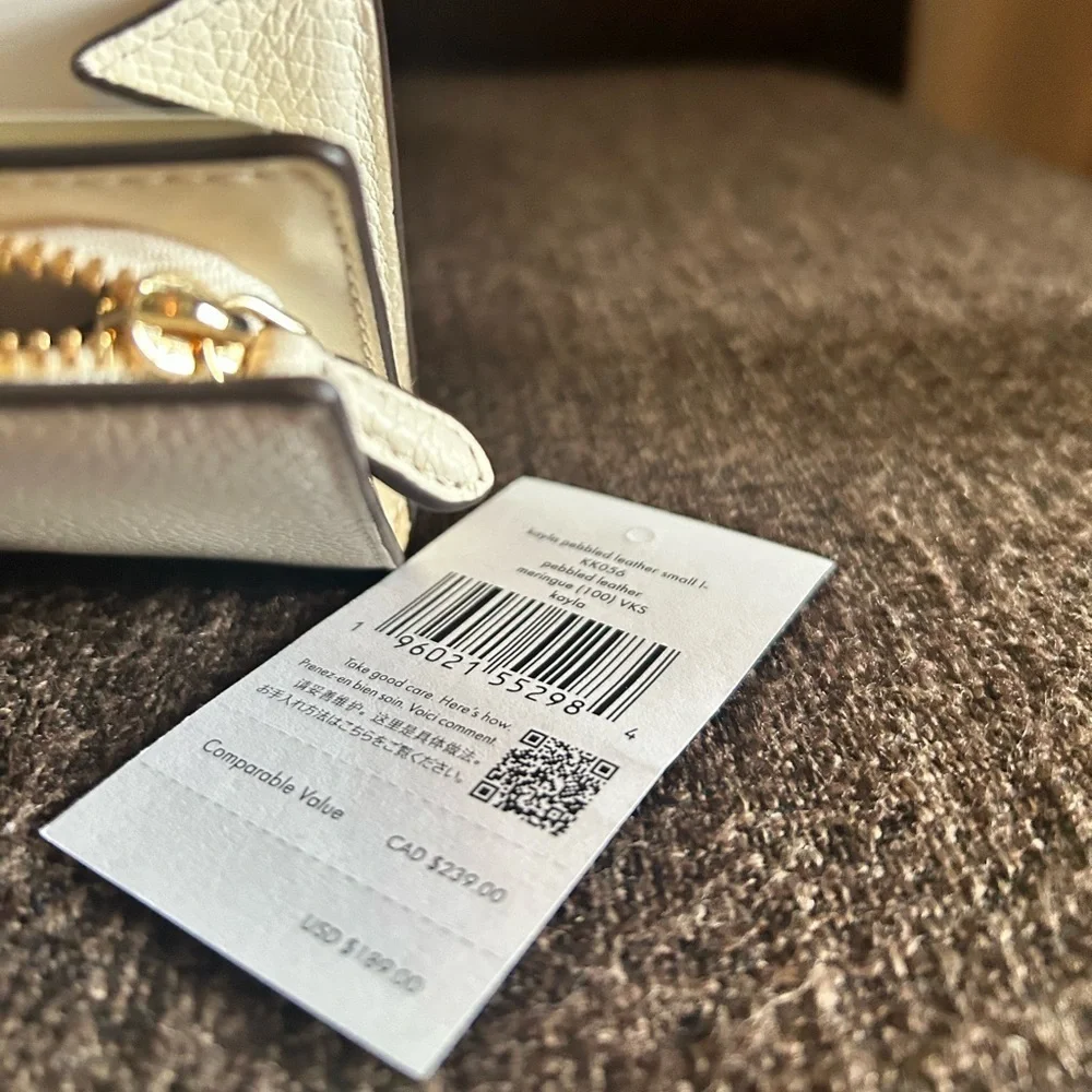 NWT- Kate Spade L- Zip White wallet. In wrapper.